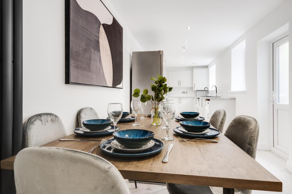 A stylish kitchen area with a modern dining set...