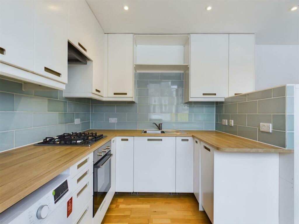 A modern and well-equipped kitchenette featurin...