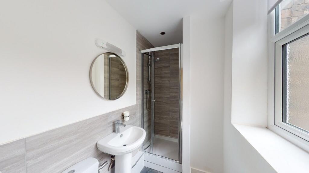 Bright and clean bathroom featuring a modern co...