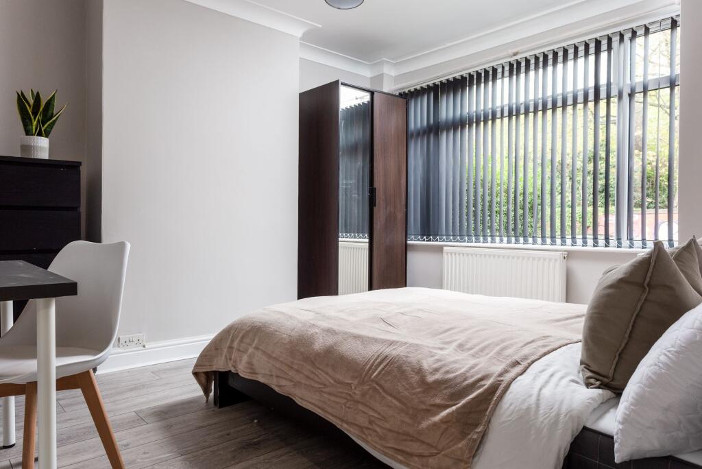 Bright and inviting double bedroom featuring a ...
