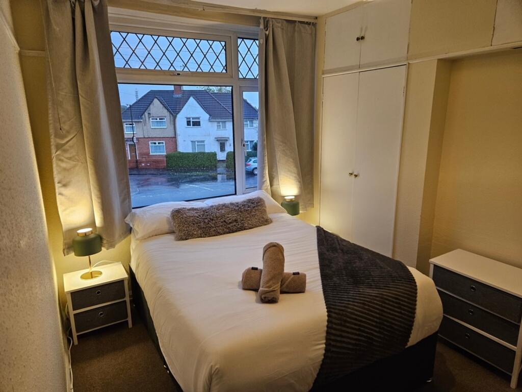 A bright and inviting double bedroom featuring ...