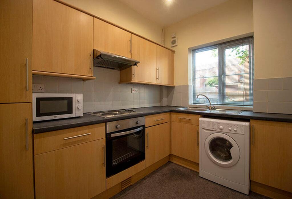 This well-appointed kitchen features modern app...