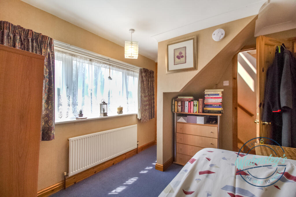 Bedroom two to rear with storage