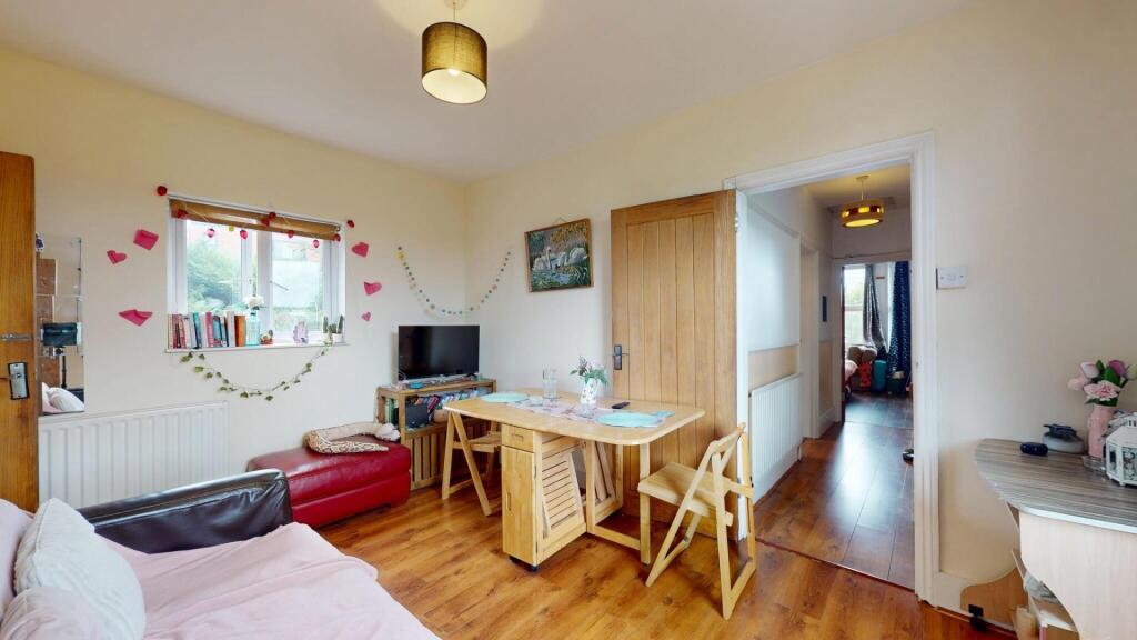 Bright and welcoming living room featuring warm...