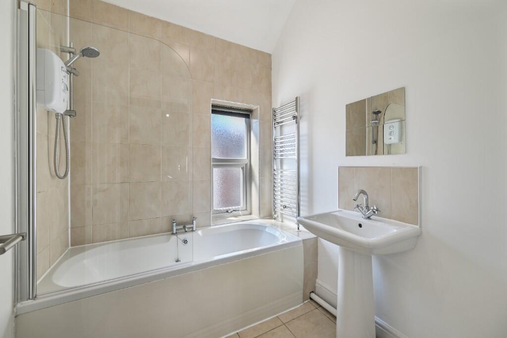 A bright and clean bathroom featuring a modern ...