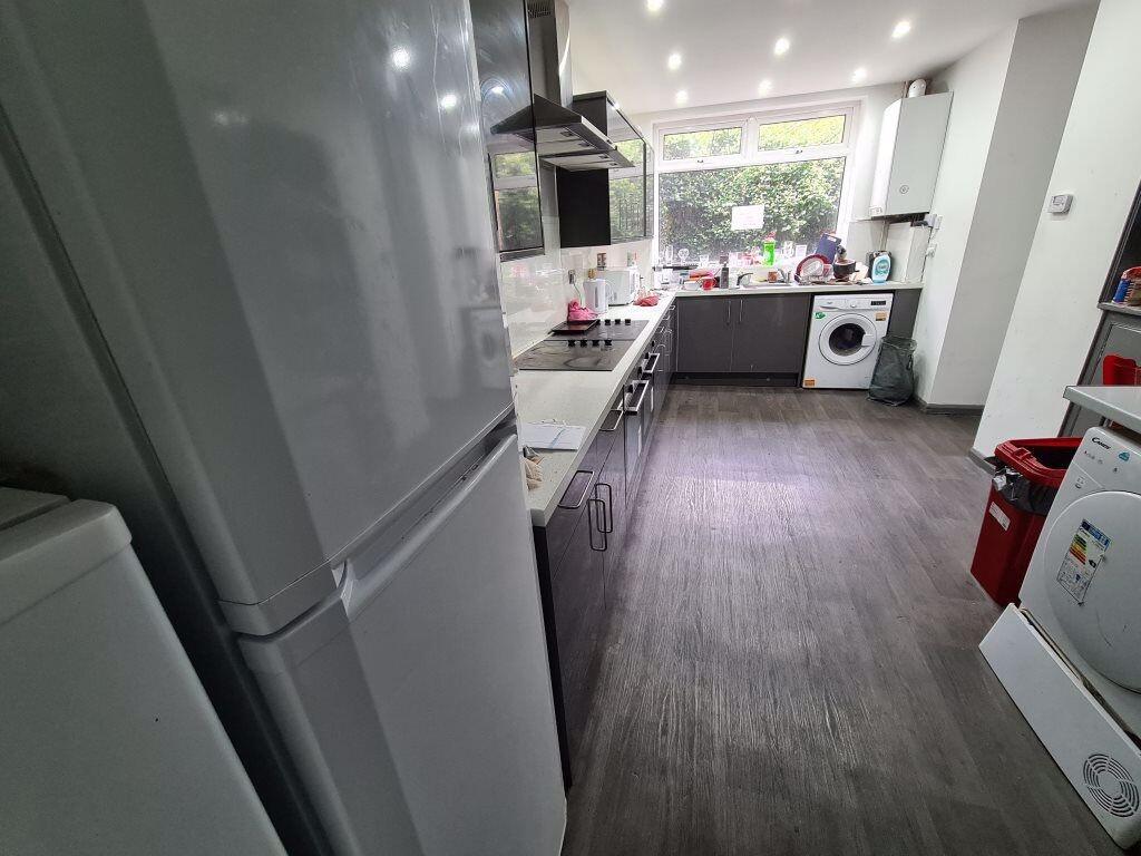 Bright and modern kitchen featuring ample count...