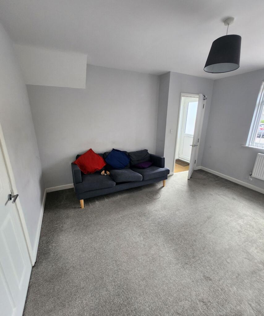 Bright and welcoming living room featuring a co...