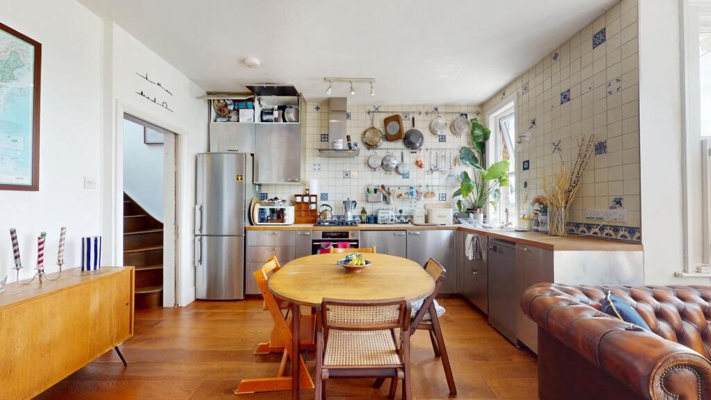 Bright and inviting kitchen featuring a spaciou...