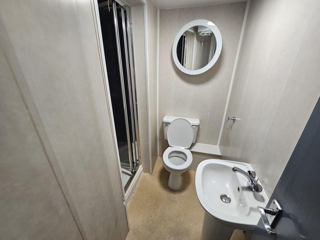 Bright bathroom featuring a clean white sink, m...