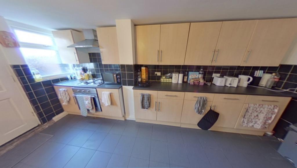 Bright and spacious kitchen featuring ample sto...