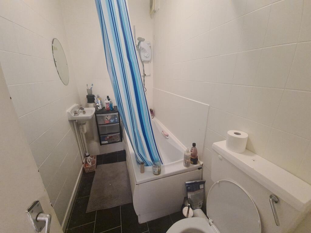 A clean and functional bathroom featuring a bat...