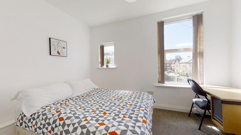 A bright and neatly presented double bedroom fe...