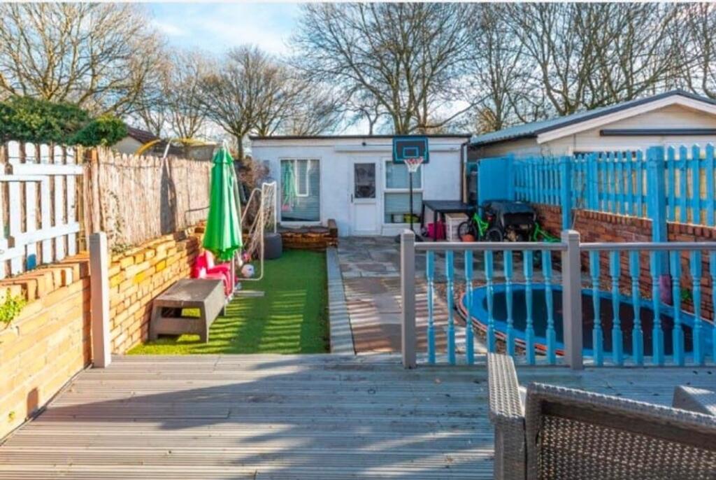 A spacious and well-maintained garden area with...