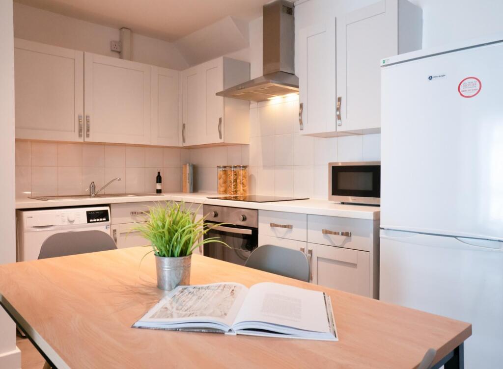 A bright and modern kitchenette, perfect for st...