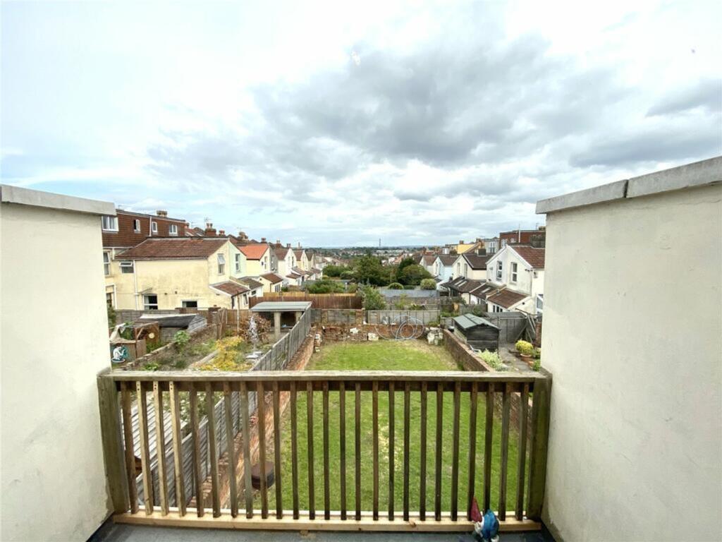 Spacious garden area with well-maintained grass...