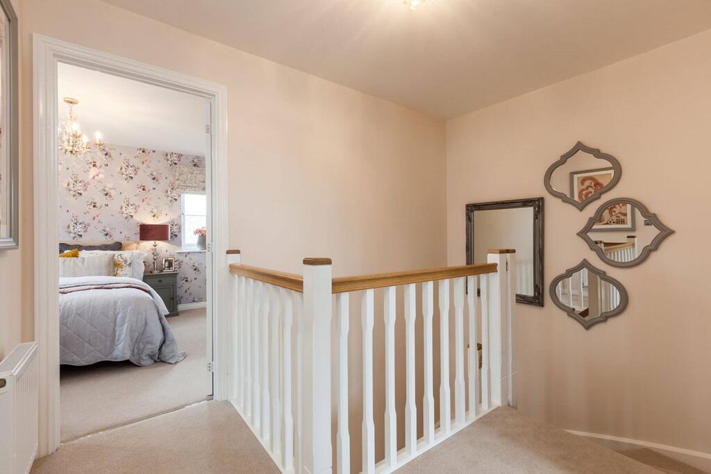 A bright landing welcomes you upstairs