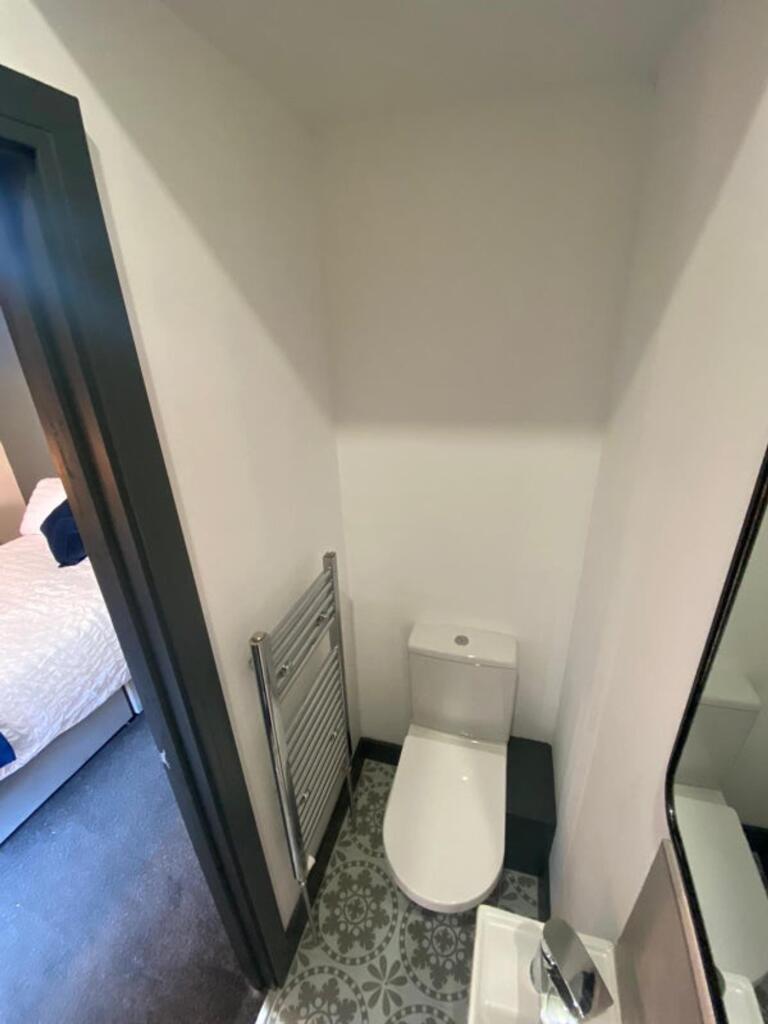 A stylish and modern single toilet featuring sl...