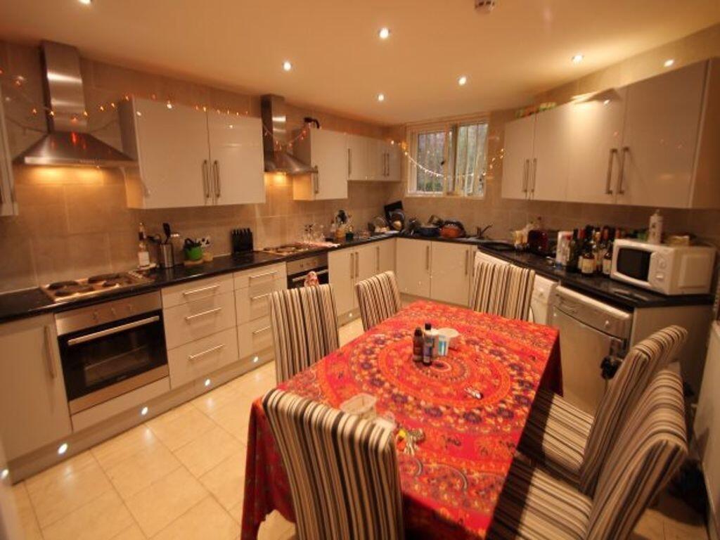 A modern, spacious kitchen featuring ample cabi...