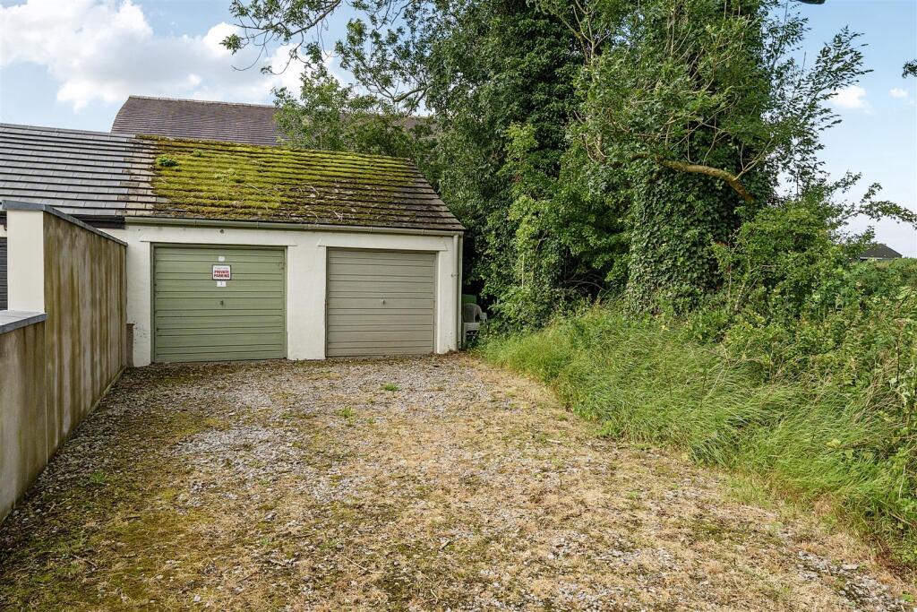 EXTERNALLY - GARAGE AND PARKING