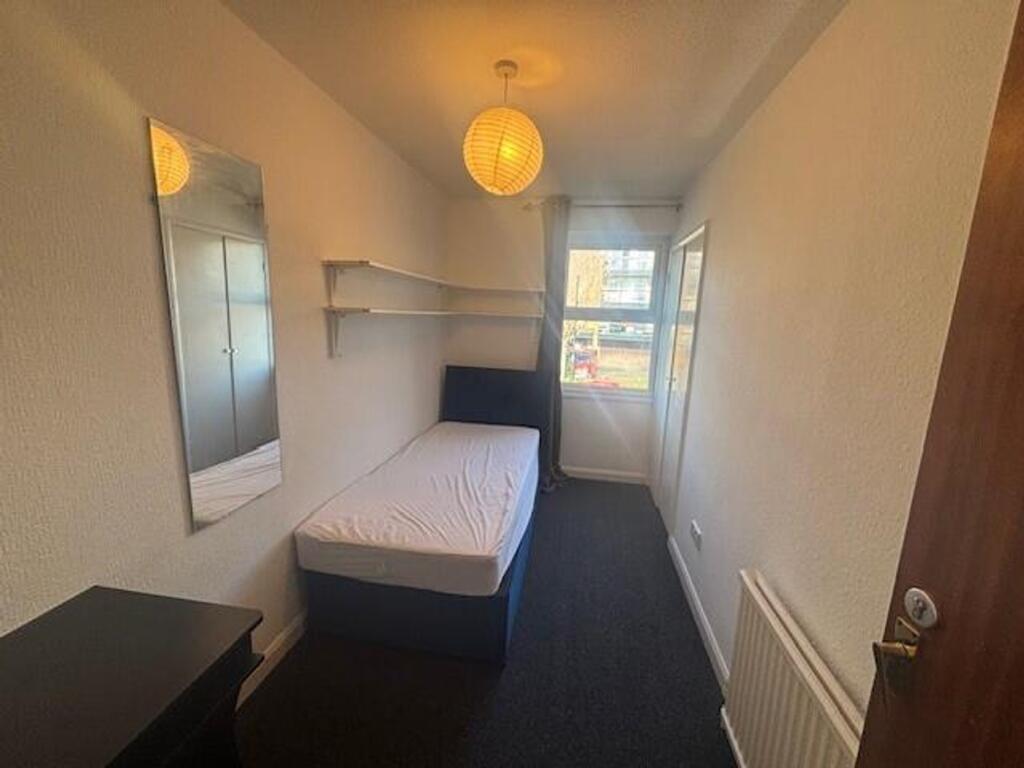 Bright and inviting single bedroom featuring a ...