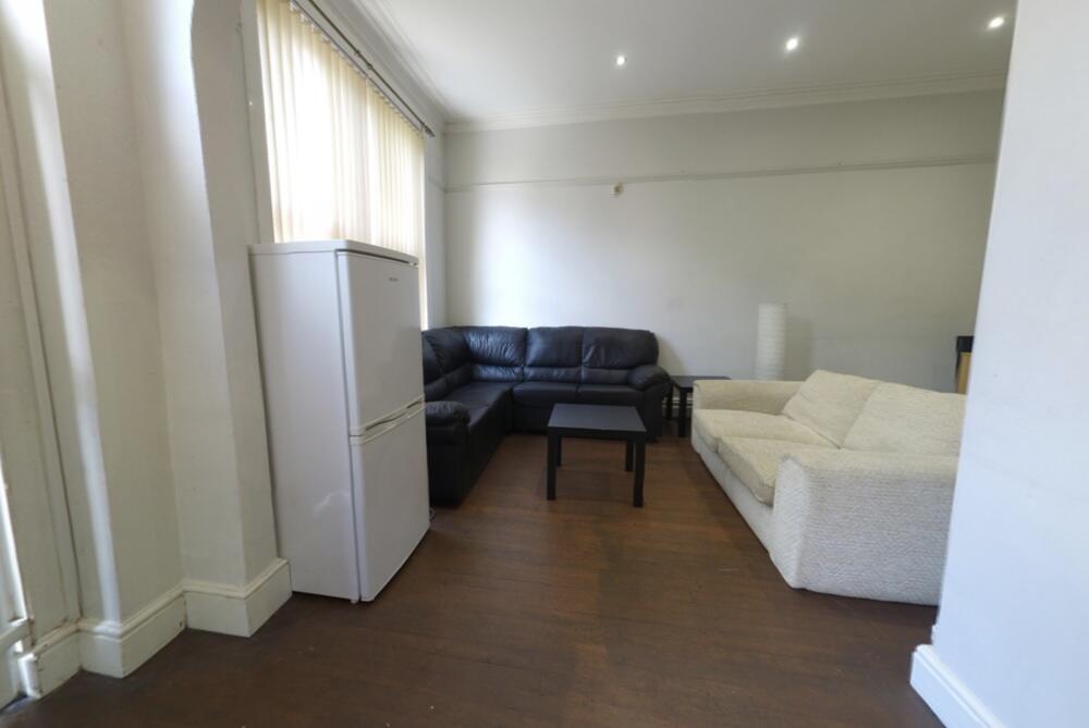 A spacious and well-maintained living room feat...