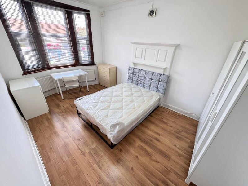 Bright and airy double bedroom featuring a comf...