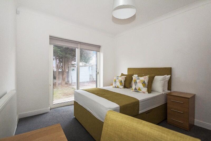 Bright and inviting double bedroom featuring a ...