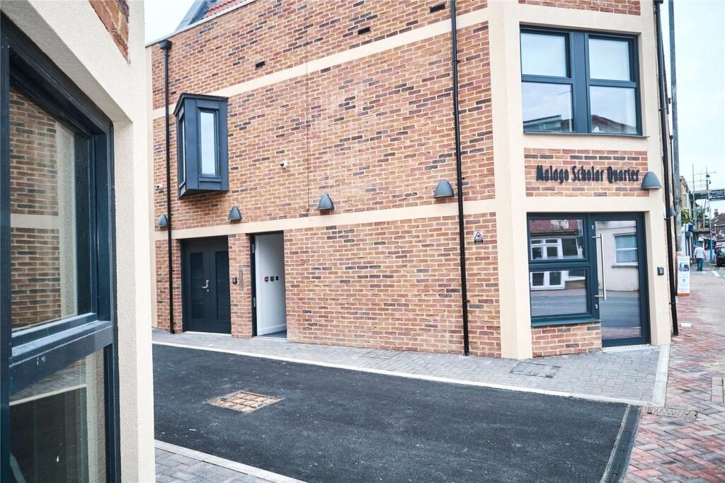 A clean and well-maintained modern brick terrac...