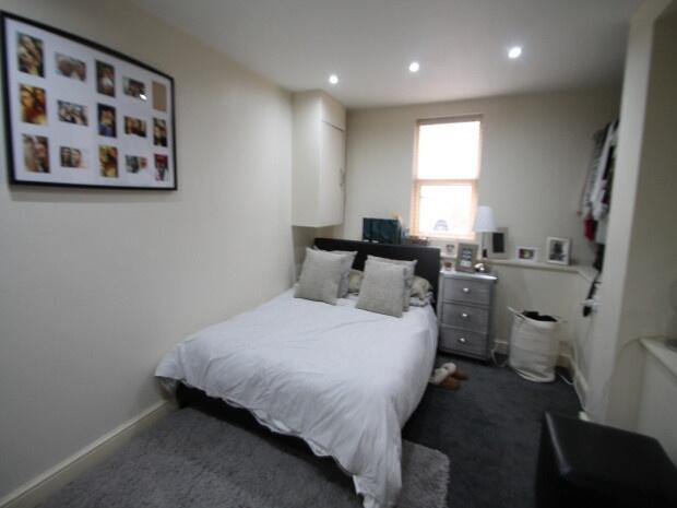 Bright and inviting bedroom featuring a comfort...