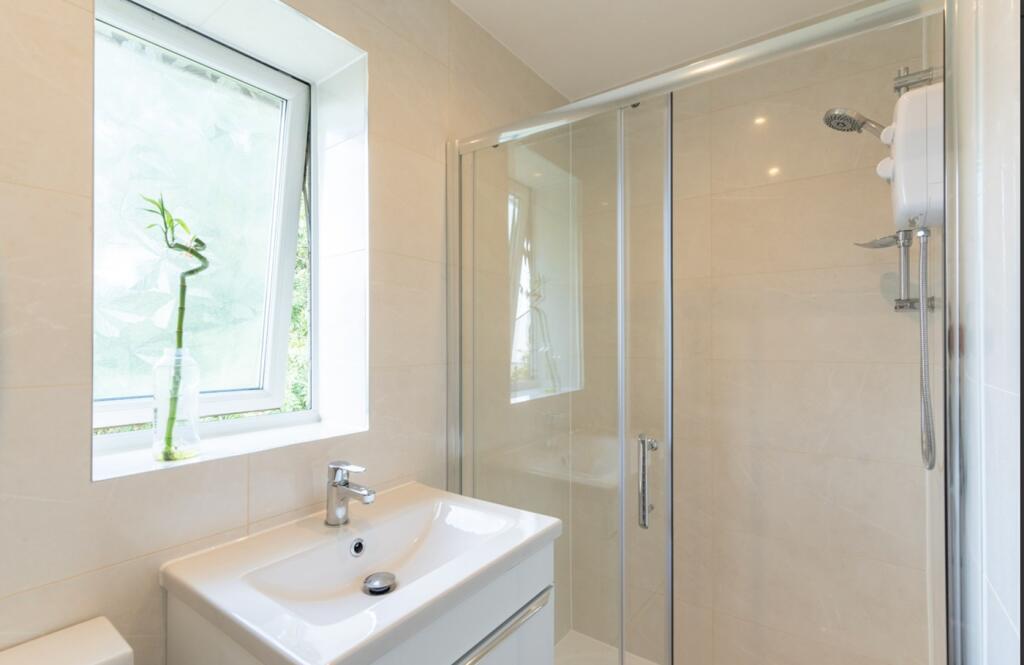 A modern and clean bathroom featuring a stylish...