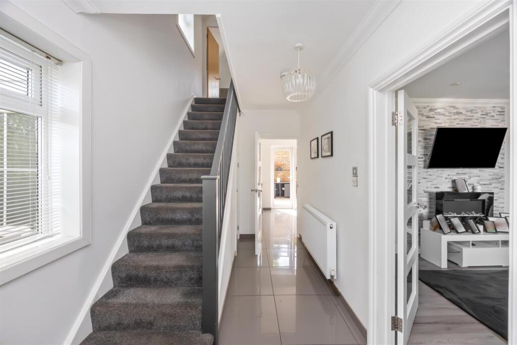 Stairs rising to First Floor