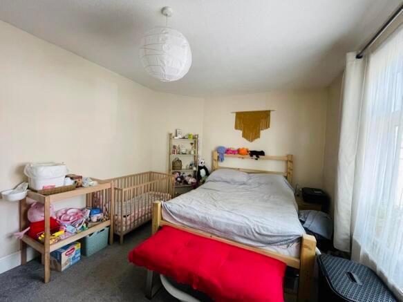 A cozy double bedroom featuring a comfortable d...