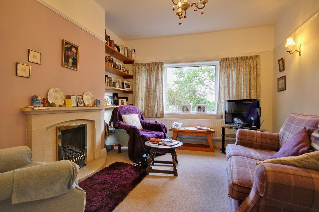 Rear sitting room with stunning fireplace