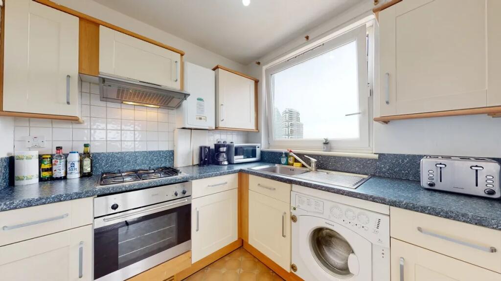 Bright and well-maintained kitchen featuring mo...