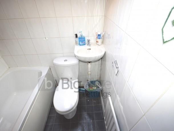 A clean and functional bathroom featuring a bat...