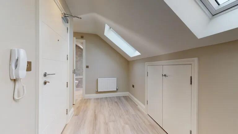 Bright and clean hallway with modern light wood...
