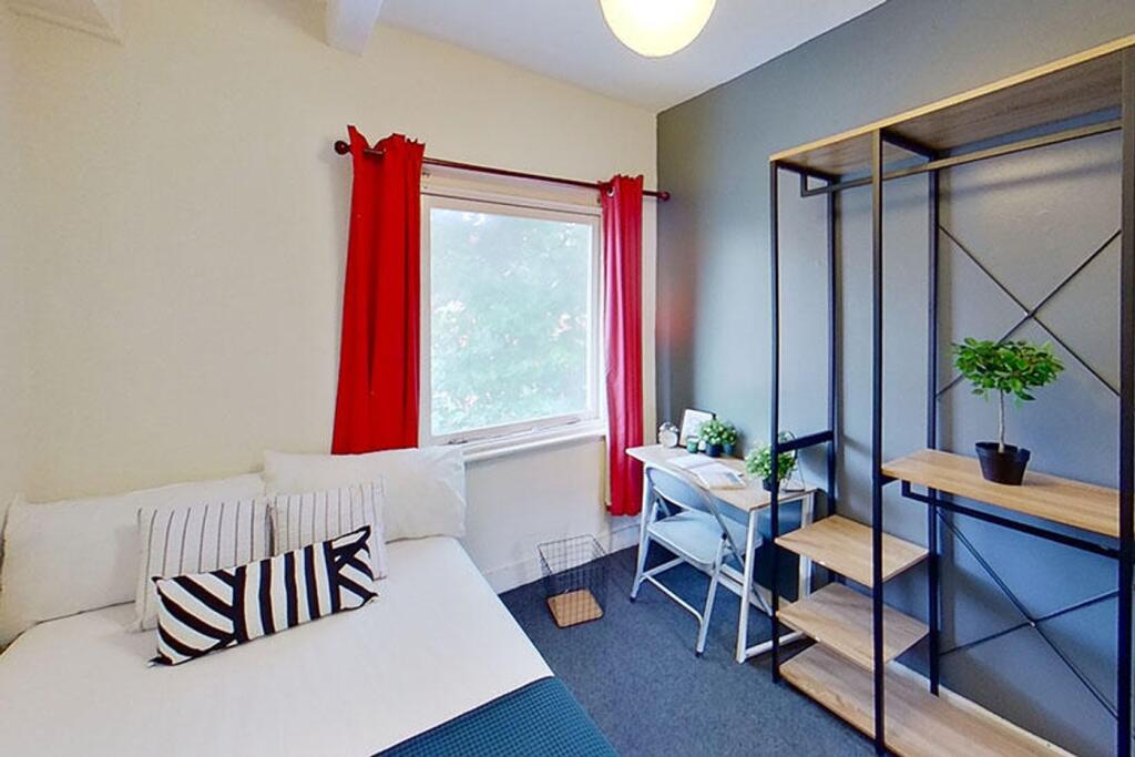 Bright and inviting double bedroom featuring a ...