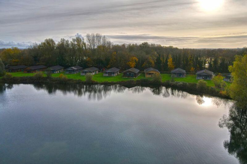 Aerial view of lodge from over the lake