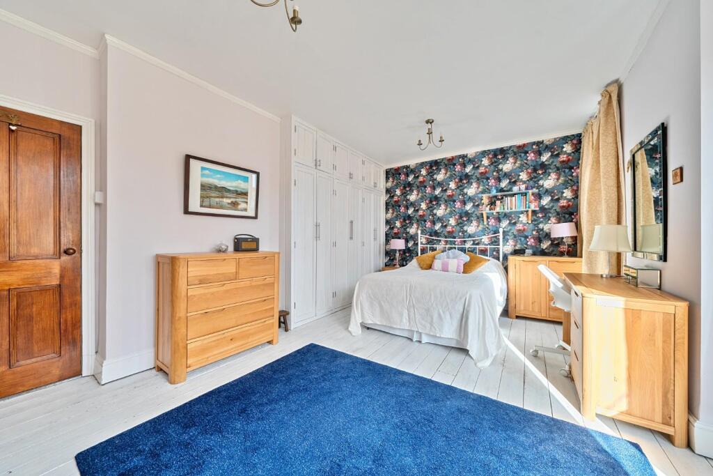 Bedroom 1 with wardrobes.jpg