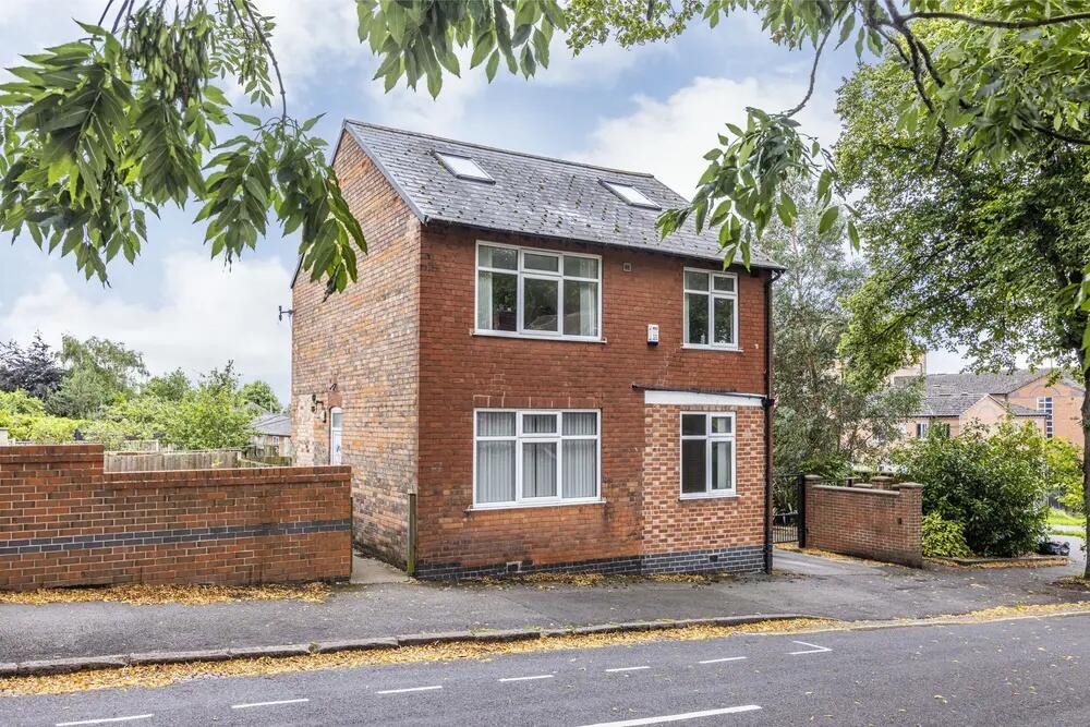 Charming detached house with a classic brick ex...