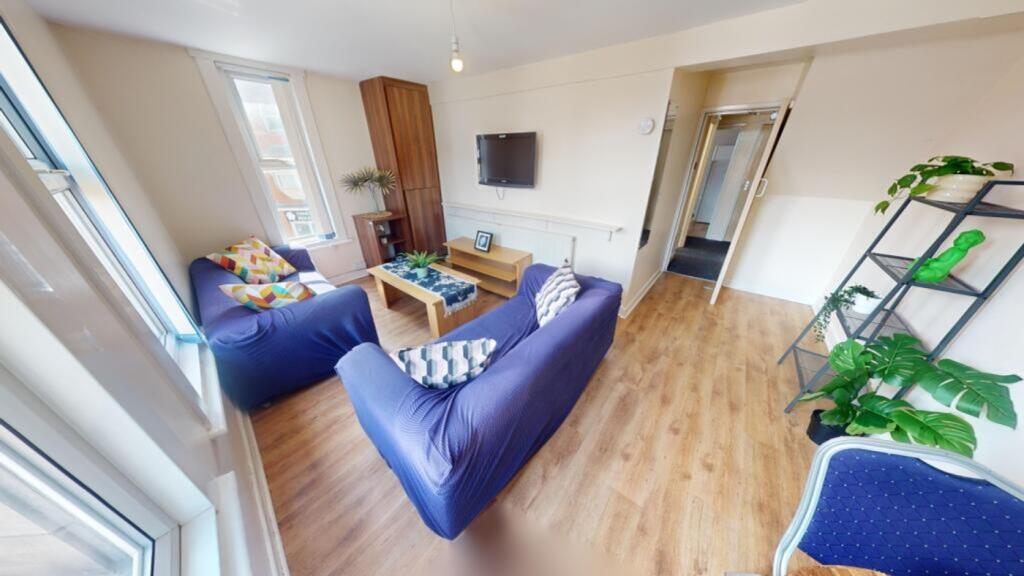 A bright and spacious modern living room, perfe...