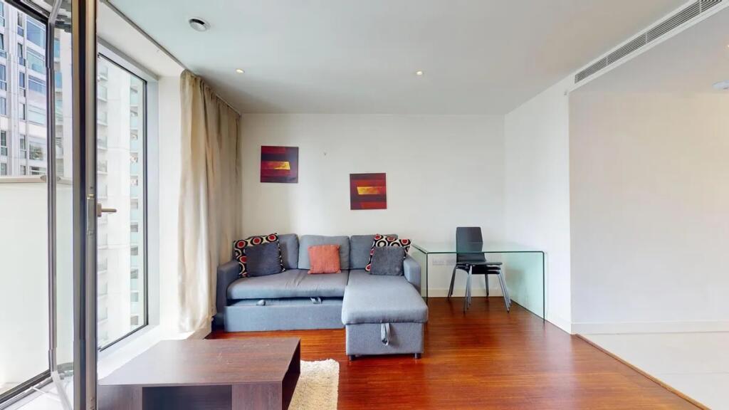 Bright and modern living room with a comfortabl...