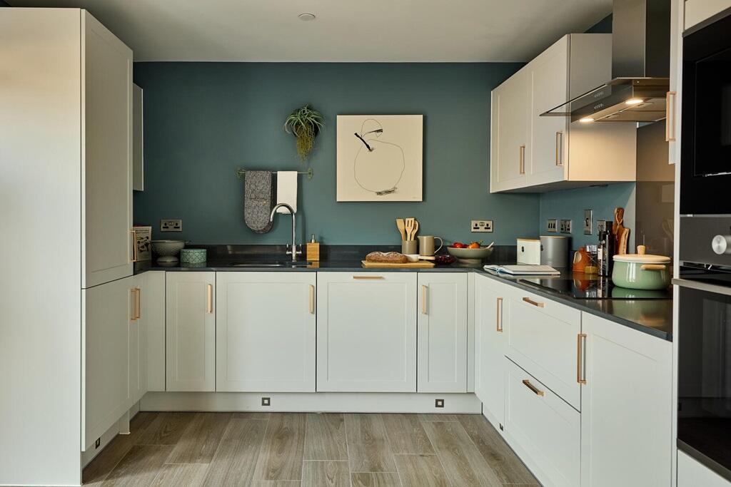 Long kitchen to one side of the home