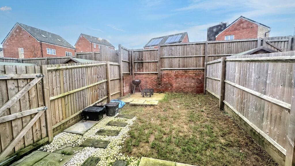 A spacious garden area perfect for outdoor rela...
