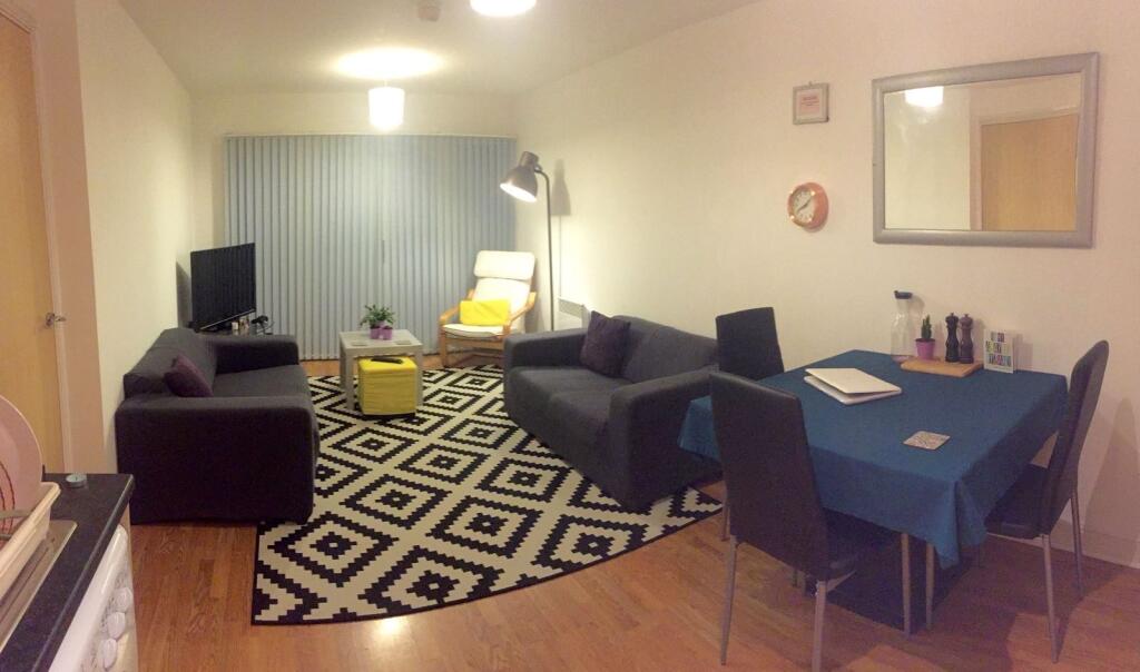 A cozy and well-furnished living room featuring...