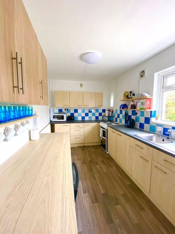 This modern kitchen features a bright and invit...
