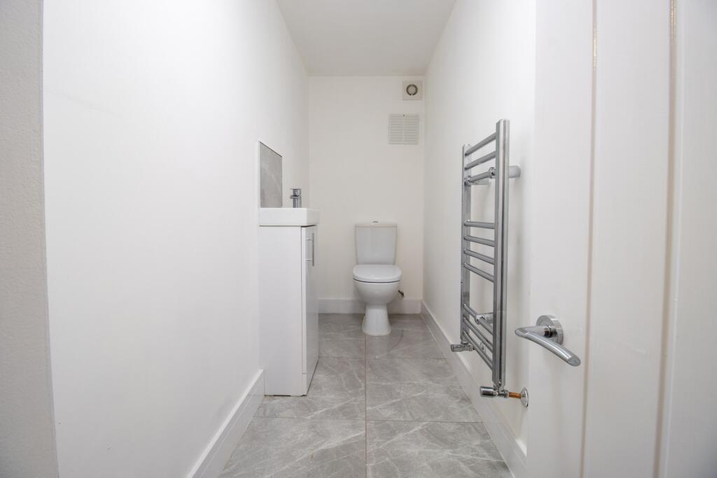 A clean and well-maintained bathroom with a toi...