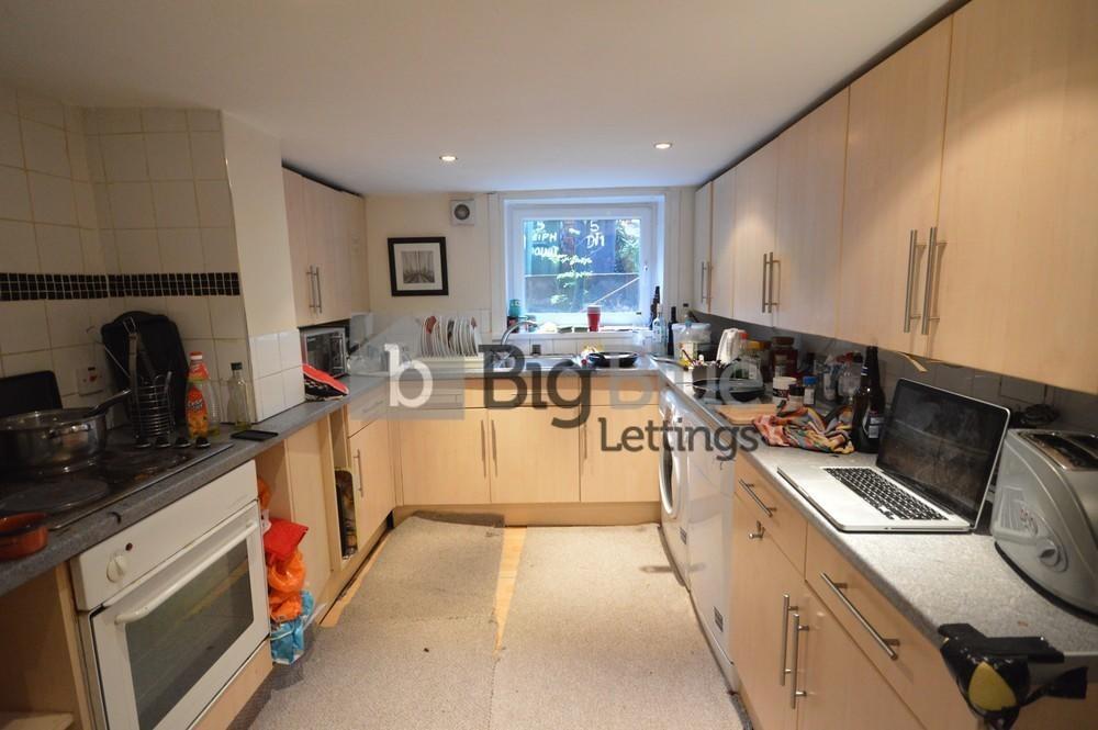 Bright and functional kitchen with ample cabine...