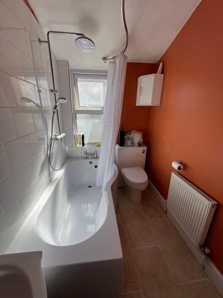 A bright and spacious bathroom featuring a mode...