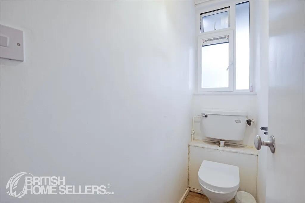 Compact and functional single toilet room featu...